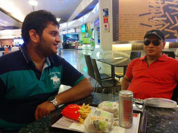 Delhi Airport .. Gorging burgers early in the morning :p